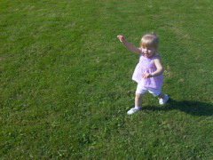 Erica runs towards swings